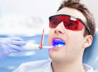 Man receiving laser dentistry dental treatment